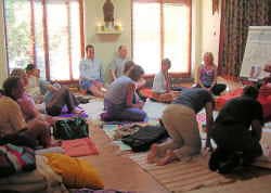 A circle of seekers seated together indoors.