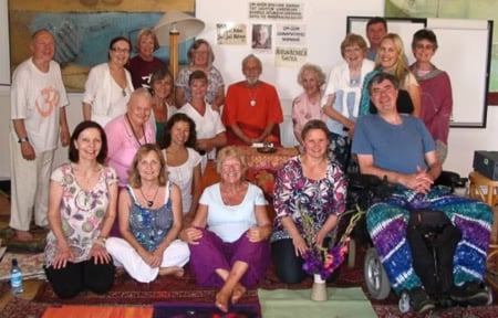 Archive image of a reflective group moment from Muz Murray mantra workshop gatherings.
